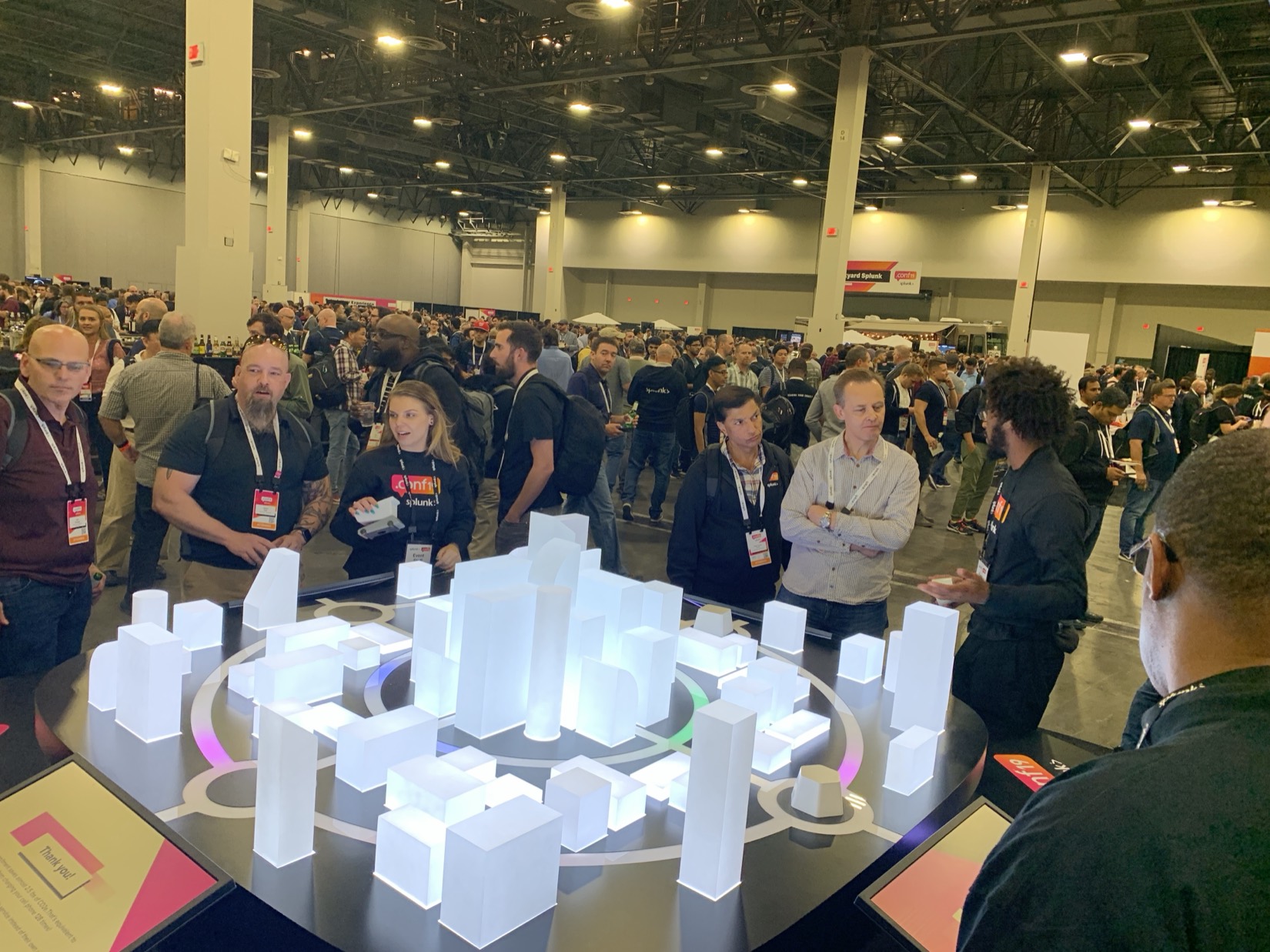 Attendees gathered around the Every Byte Counts illuminated smart-city model on the .conf19 show floor.